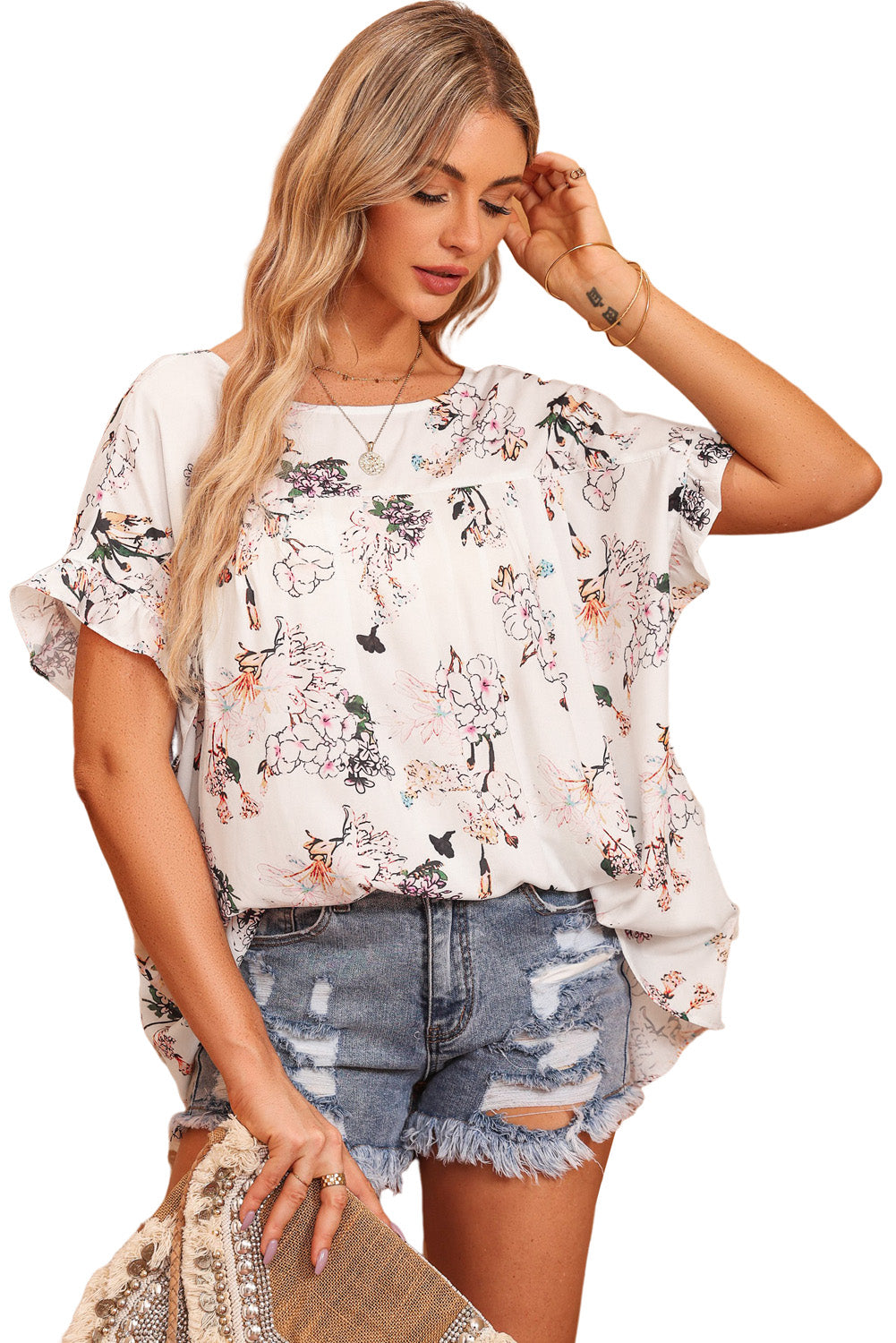 Blusa floral con cuello barco y manga volante